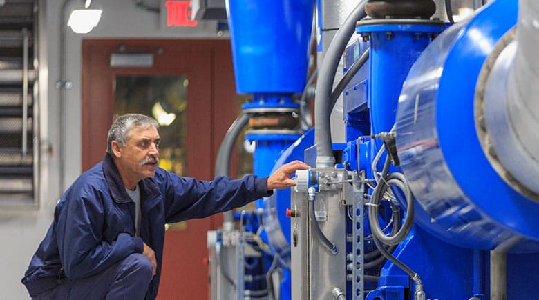 Man checking water tanks