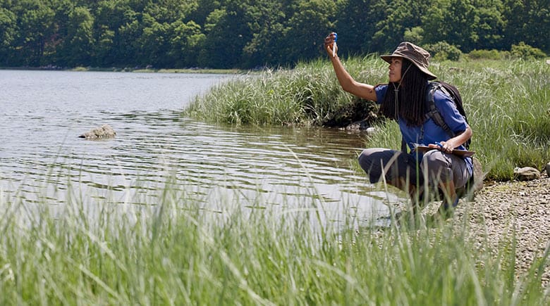Woman measuring water levels