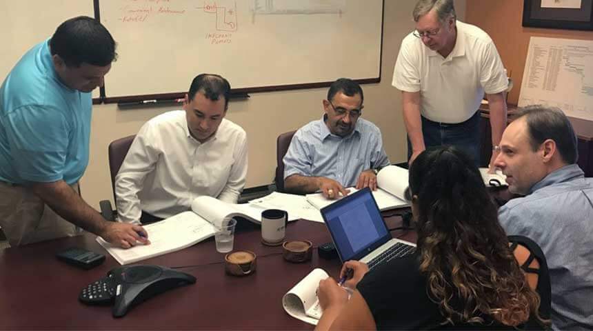 several people working around a conference table