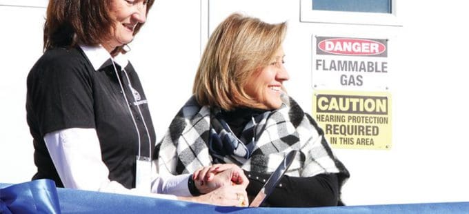 Two women at ribbon cutting ceremony