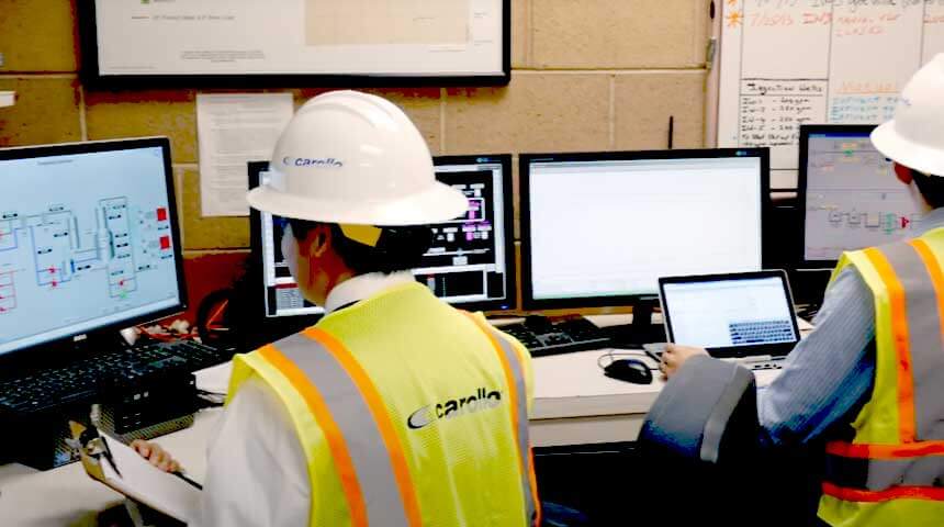 two people in hard hats using Blue Plan-it