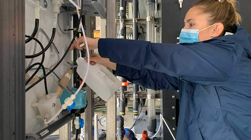 Woman Gathering Water Sample
