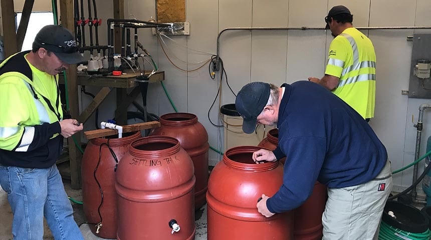 Water testing with three employees at Salem Geren Island