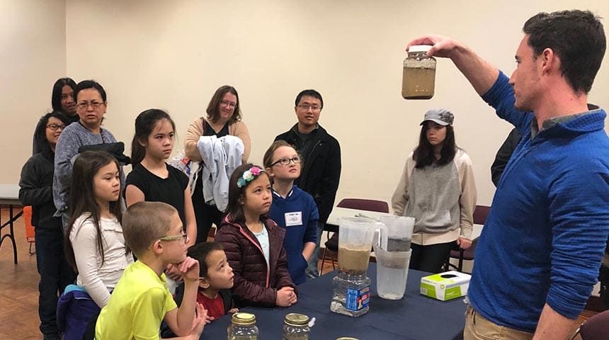 Carollo Cares event with water experiment kids and families