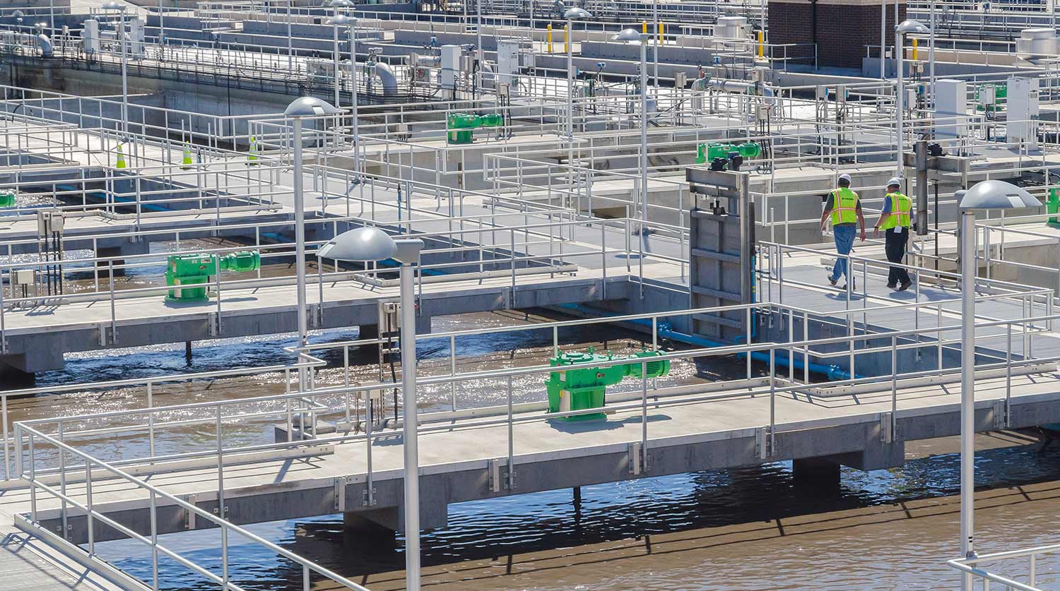 Engineers walking at wastewater plant