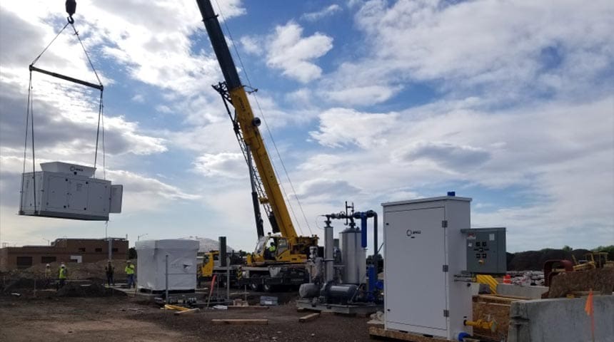 Crane lifting material at the Biogas Treatment and Renewable Natural Gas Fueling Station