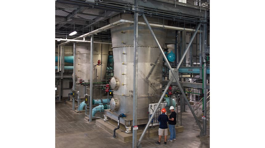 people standing next to reactors
