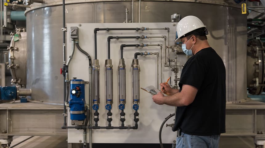 man standing next to reactor