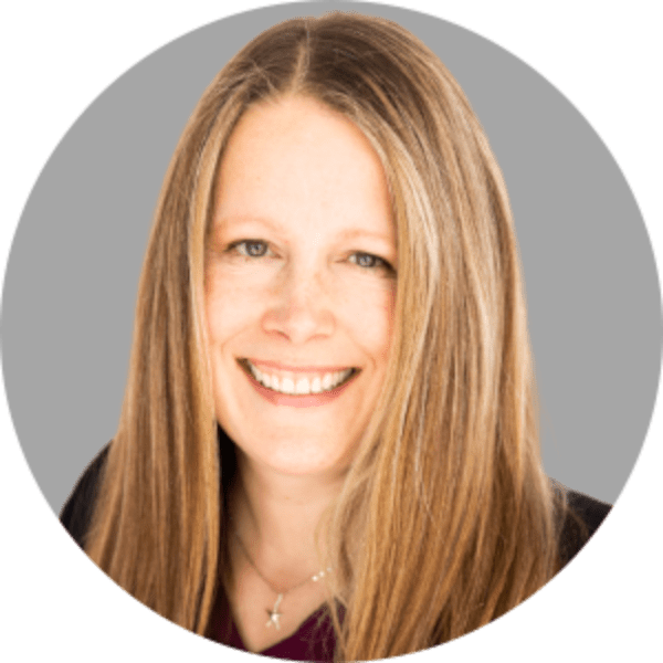 portrait of Caroline Burger with long blonde hair and a big smile.