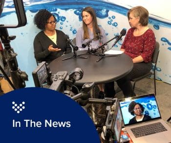 photo of a bridge over a small river with people running on a path along the water that represents Carollo's Resilience and Sustainability practice.