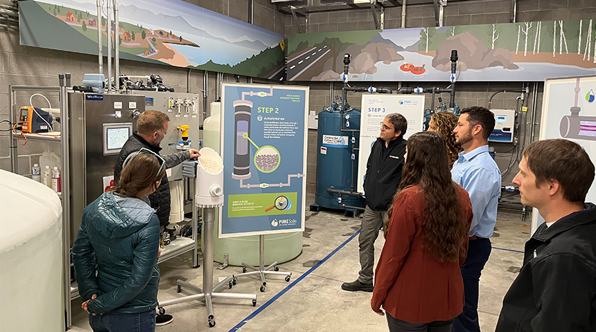 Interior photo of the South Jordan Pure SOJO facility where people are getting a demonstration of water reuse by Carollo Engineers.