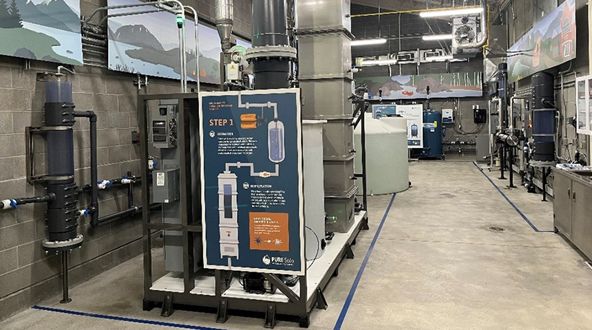 Interior photo of the South Jordan Pure SOJO facility where people are getting a demonstration of water reuse by Carollo Engineers.