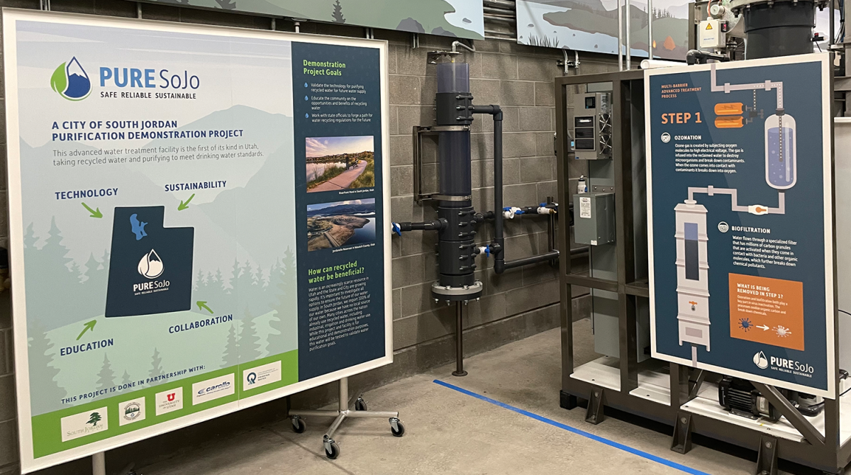 Interior photo of the South Jordan Pure SOJO facility where people are getting a demonstration of water reuse by Carollo Engineers.