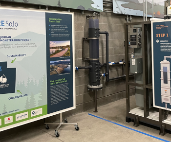 Interior photo of the South Jordan Pure SOJO facility where people are getting a demonstration of water reuse by Carollo Engineers.