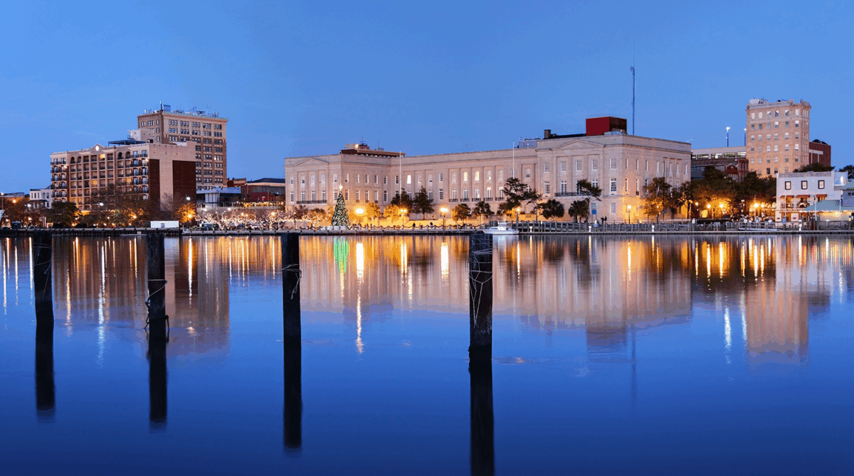 Dusk photo of a North Carolina town representing Carollo's work with CFPUA on their Northern Regional Pump Station.
