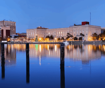 Dusk photo of a North Carolina town representing Carollo's work with CFPUA on their Northern Regional Pump Station.
