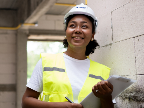 Photo of a worker with a clipboard on site