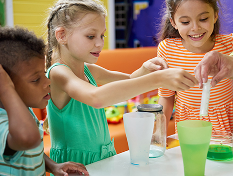 children doing a STEAM STEM water science experiment